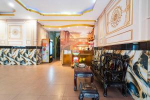 a lobby with a room with a table in it at Collection O Bao Duy Hotel in Ho Chi Minh City