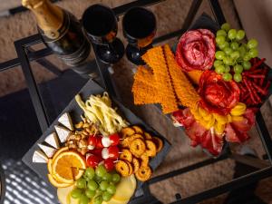 a table with a bunch of different types of food and drinks at Hideaway in Ostrava +5 photos