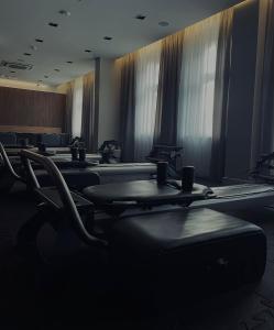 a conference room with tables and chairs and windows at Aparthotel Platinum Apartamenty in Inowrocław