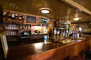 a bar with a lot of bottles of alcohol at Fishermans Tavern in Dundee +16 photos