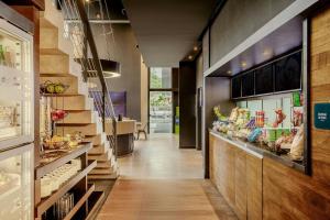 a bakery with a long hallway with a food counter at Aloft by Marriott Asuncion in Asunción