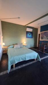 a bedroom with a large bed in a room at El Atelier - Valle de Uco in La Consulta