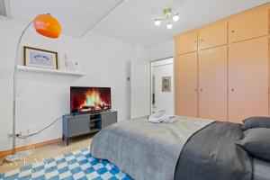 a bedroom with a bed and a fireplace at Appartement à Belair in Hollerich