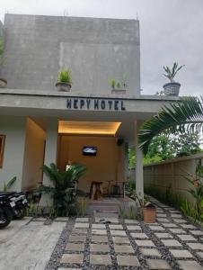 a hotel with a sign that reads mercy hospital at Hepy Hotel in Kuta Lombok +9 photos