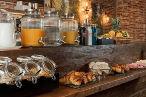 a buffet with croissants and pastries on a table at Hotel Boccaccio in Florence