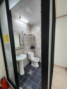 a bathroom with a toilet and a sink at 24 Guesthouse Suncheon in Suncheon +32 photos