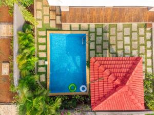 an overhead view of a swimming pool in a yard at EKOSTAY - Trinity Villa in Karjat