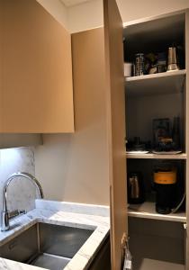 a kitchen with a sink and a counter top at Brera Elegant in Milan +25 photos