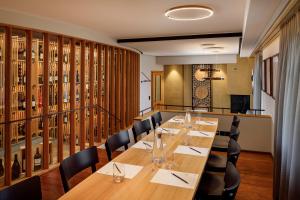 a dining room with a long table and chairs at Hotel Restaurant Schiff in Pfäffikon