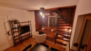a living room with a couch and a television at Vila Lika in Zlatibor