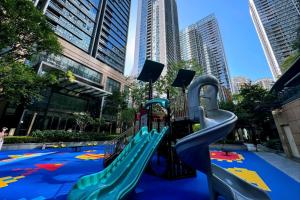 a playground in the middle of a city at Happy Hours in Shenzhen
