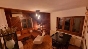 a living room with a couch and a table at Vila Lika in Zlatibor