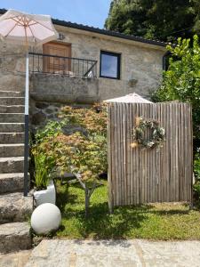 a wooden fence in front of a house at Quinta da Lembrança in Arcos de Valdevez