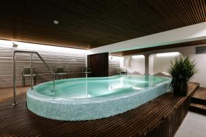 a jacuzzi tub in a hotel room at Hestia Hotel Kentmanni in Tallinn