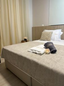 a bed with two pillows on top of it at Nesea Seaside Luxury Escape in Protaras +106 photos