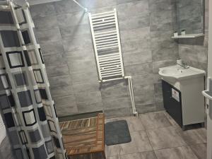 a bathroom with a toilet and a sink at Casa ROOL in Turda +38 photos