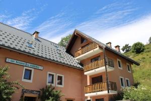 a building with balconies on the side of it at Les biches in Roubion