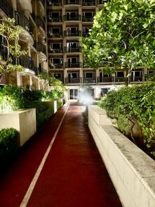 a red carpet path in a large building at Staycation near MOA at Monarch in Manila