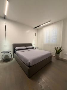 a bedroom with a large bed and a window at Nuovo Fiore in Pesaro