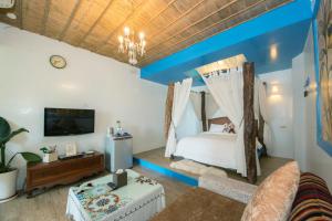A bed or beds in a room at Blissful Star