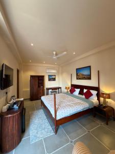 a large bedroom with a bed and a television at The Solo House in Jodhpur +86 photos