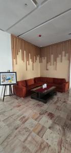 a living room with a couch and a table at Hotel Anna Agadir in Agadir