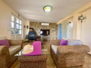 a living room with a couch and a table at Villa Maja in Sutomore +21 photos