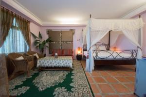 A bed or beds in a room at Blissful Star