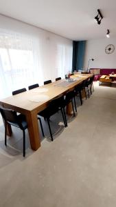 a large conference room with a long table and chairs at Chalupa pod Cárinkou in Zboj