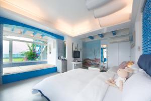 A bed or beds in a room at Blissful Star