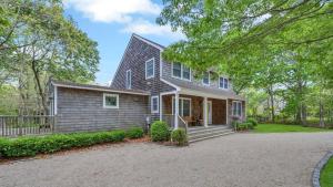 a home with a gambrel roof at Villa Willow & Waves in East Hampton