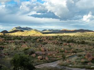 a view of a desert with mountains and rocks at Namibgrens Guest Farm in Namibgrens