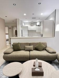 a living room with a couch and a table at اورا بلس AURA PALACe in Taif