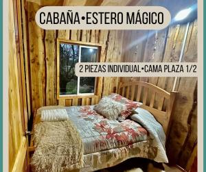 a poster of a bedroom with a bed and a window at Cabaña Estero Mágico in Cochamó