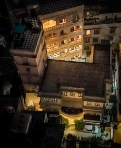 an overhead view of a tall building at night at Shree Ganesha Palace Near Kashi Vishwanath Temple in Varanasi +111 photos