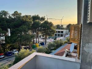 a view of a street from a balcony of a building at apartman FML Cres in Cres +10 photos