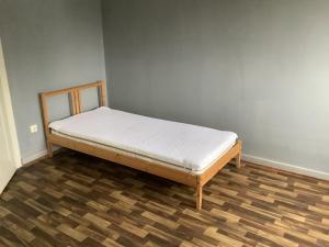 a bed in a room with a white mattress at Adler in Kraichtal