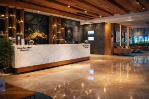 a lobby with a reception desk in a building at Dosso Dossi Hotels & SPA Downtown in Istanbul +144 photos