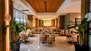 a conference room with tables and chairs in a building at Dosso Dossi Hotels & SPA Downtown in Istanbul