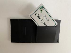 a black box with a sign on top of it at Pensión Casa Cancela in Palas de Rei
