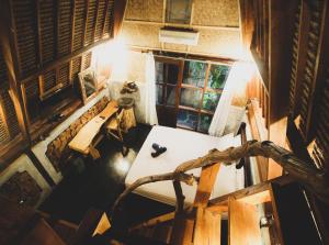an overhead view of a room with a table and a window at Bale Jukung in Tanjung