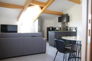 a living room with a couch and a table at Casa di a Volpe in Corte