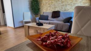 a plate of food on a table in a living room at Apartalux Pax Palace in Las Negras