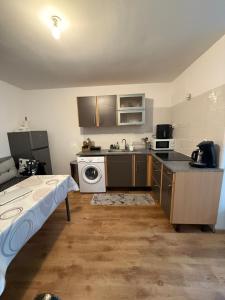 a kitchen with a sink and a dishwasher at Duplex proche aéroport CDG et Paris in Sarcelles