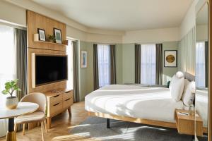 a bedroom with a large bed and a tv at master St. Paul's in London +23 photos
