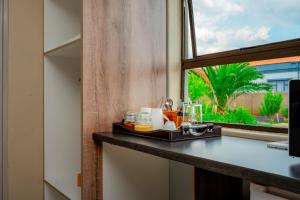 a tray of food on a counter next to a window at Infinity Home BnB in Leribe