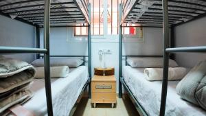 a room with two bunk beds and a window at Apartalux Magic Silver in Oropesa del Mar