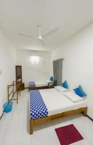 a bedroom with a large bed in a room at Meegas Sewana Resort in Minneriya