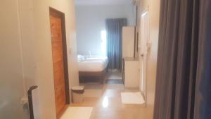 a hallway with a room with a bed and a door at Avatar Resort Phangan Thailand in Ban Nua +74 photos