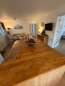 a wooden table with a toy boat on top of it at Hillhouse in Hythe
